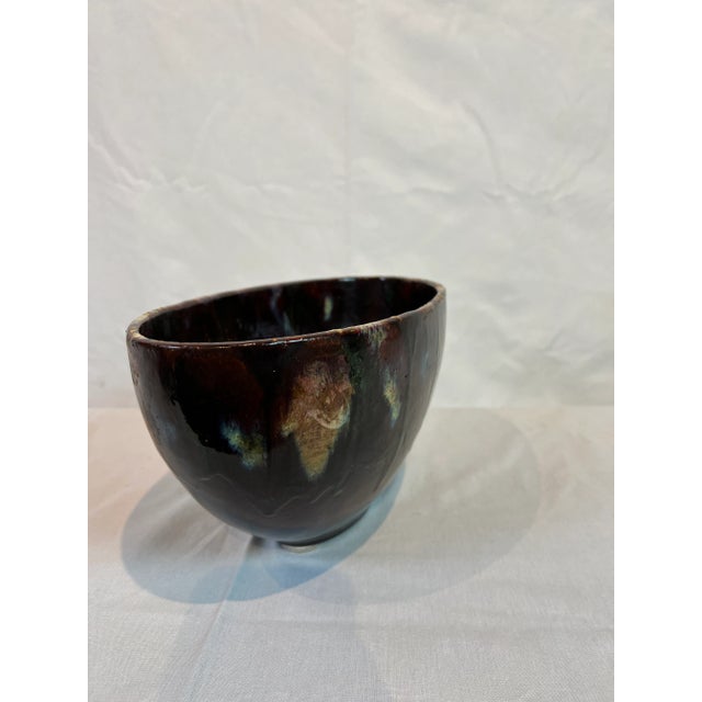 Hand painted oval centerpiece featuring a dark brown glaze over red with ivory accents. Italy.