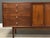 A mid century modern walnut Declaration dresser credenza with brass knobs designed by Kipp Stewart and Stewart MacDougall...