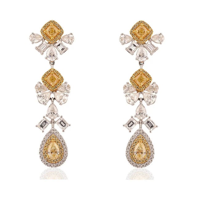 18k Earrings with 1.73 carats of natural yellow diamonds and 4.33 carats of natural white color diamonds. 14.35g