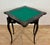 Elegant Chinese Chinoiserie games table in black lacquer, beautifully decorated with hand-painted floral motifs and...