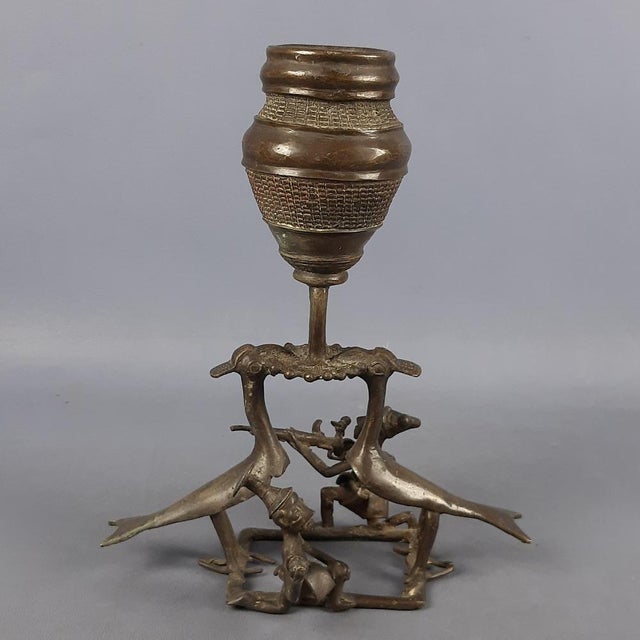 A striking, large-scale bronze sculpture of African origin (West Africa), stylistically attributable to the Ashanti...