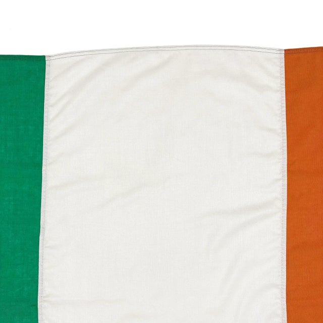 This vintage Irish flag is fully sewn from assorted materials including 100% wool, a soft synthetic, and cloth that is a...
