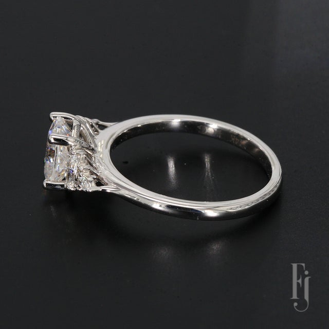 This is a 14k White Gold Engagement Ring Mounting With a 1.2ct Central Oval CZ, accented by Four Marquise & Eight Round...