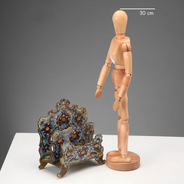 Bronze letter holder decorated with Cloisonné enamels. This piece is attributed to the mentioned designer/maker. It has no...