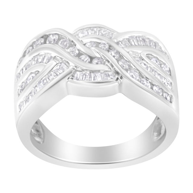 A unique women's diamond bypass ring with an intricate braided design of round and baguette diamonds. The ring is crafted...