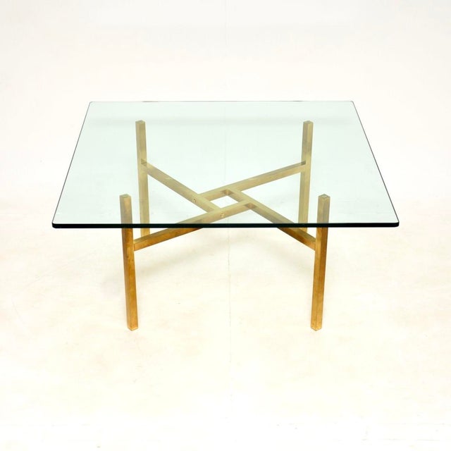 A very stylish and extremely well made vintage brass and glass coffee table. This was made in Italy, it dates from the...