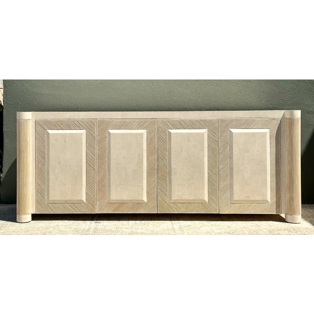 Combining sculptural texture with organic stone elements, this vintage mid-century credenza features a washed pencil reed...