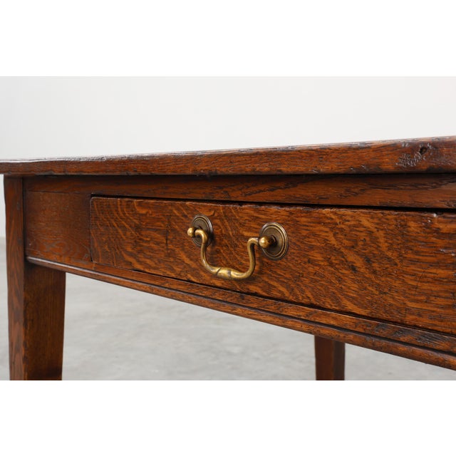 This 19th‑century French Provincial oak farmhouse table is a beautifully authentic expression of rural craftsmanship,...