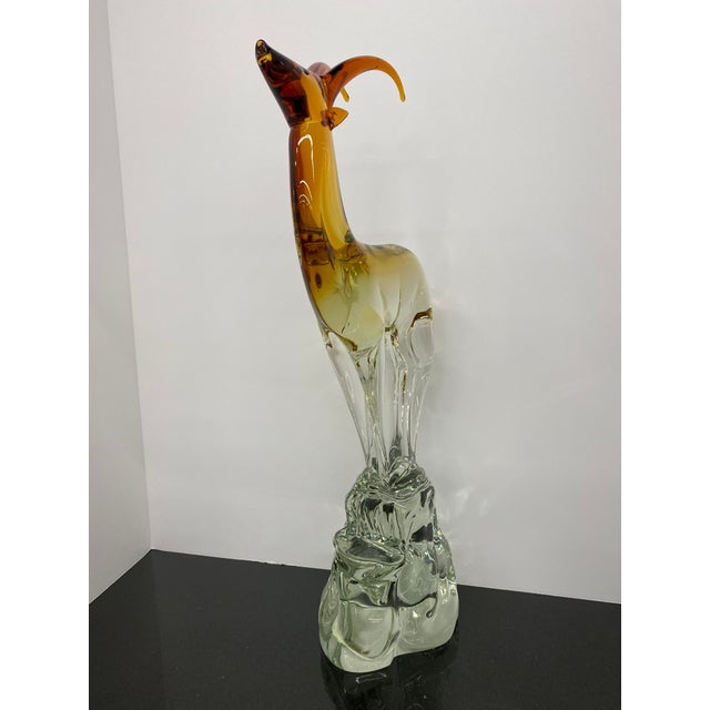 Embrace the Captivating Splendor of Salviati Murano Hand-Formed Glass Sculpture: Red Amber Antelope Experience the sheer...