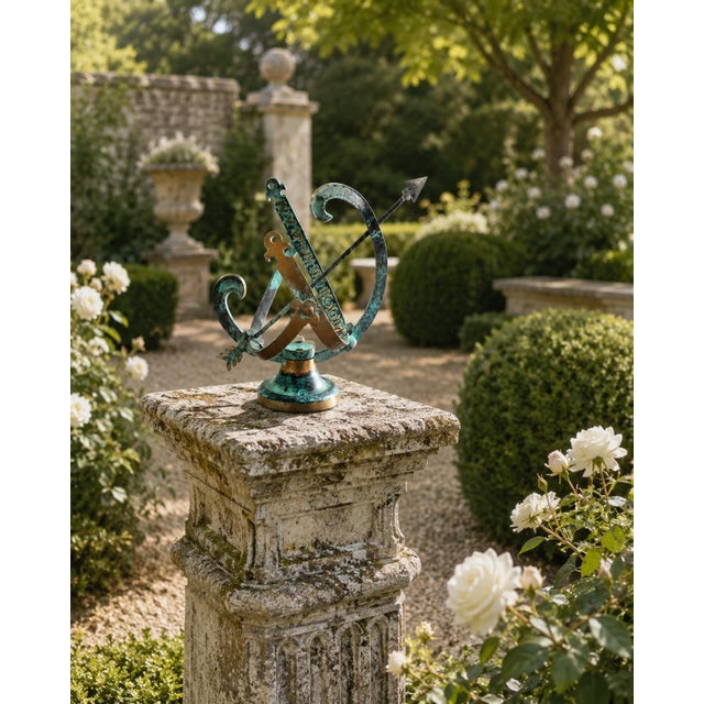 A handsome late 20th-century garden armillary sundial combining warm brass with beautifully aged verdigris metalwork. The...