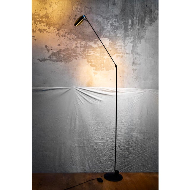 Floor lamp with direct and indirect light, featuring a metal frame and plastic details. Articulated arm, rotatable...