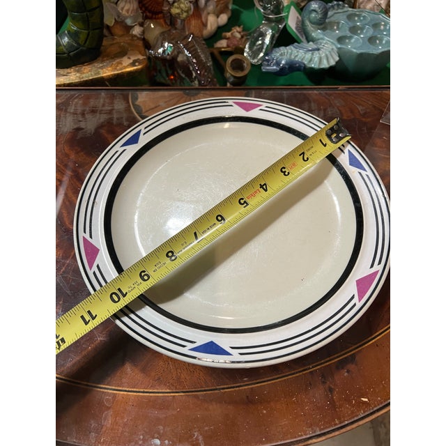 Up for consideration is a beautiful vintage white stoneware plate with blue and pink accents. This would look lovely in...
