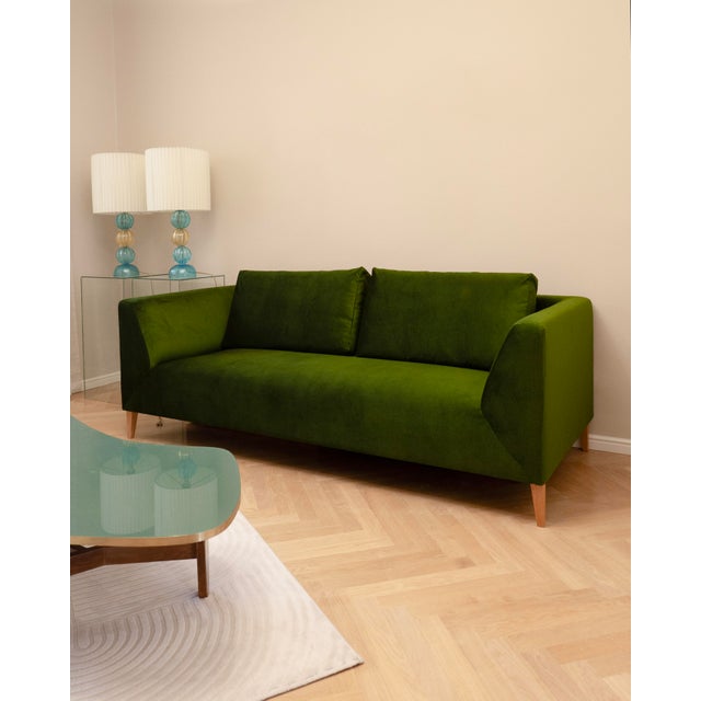 The sofa has been reupholstered in green velvet, giving it a fresh and elegant look. The color and shape are timeless and...