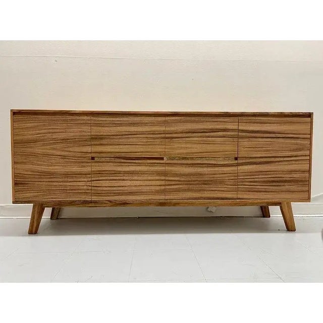 The console provides the mid-century look you crave, but with high-quality modern-day construction. Made with unadorned...