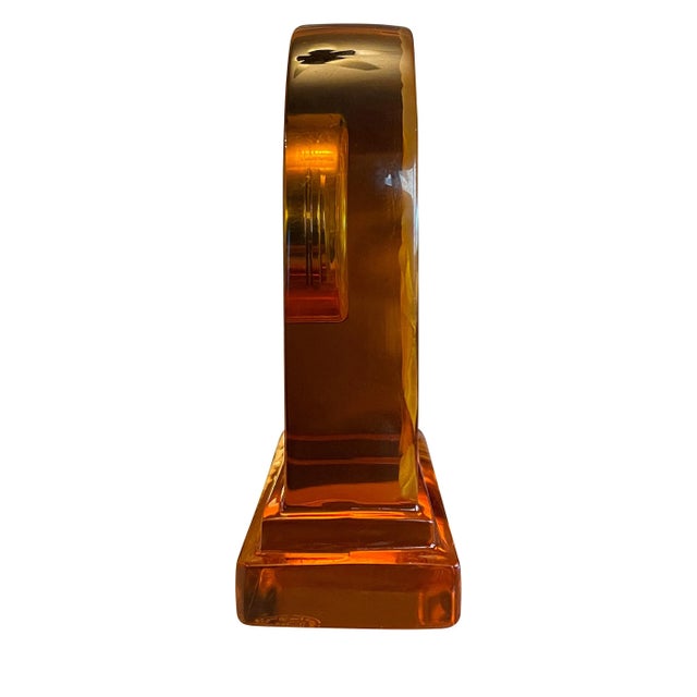 Amber crystal clock with the "Basket of Abundance" frosted pattern. Quartz mechanism clock. Signed Baccarat at the base.