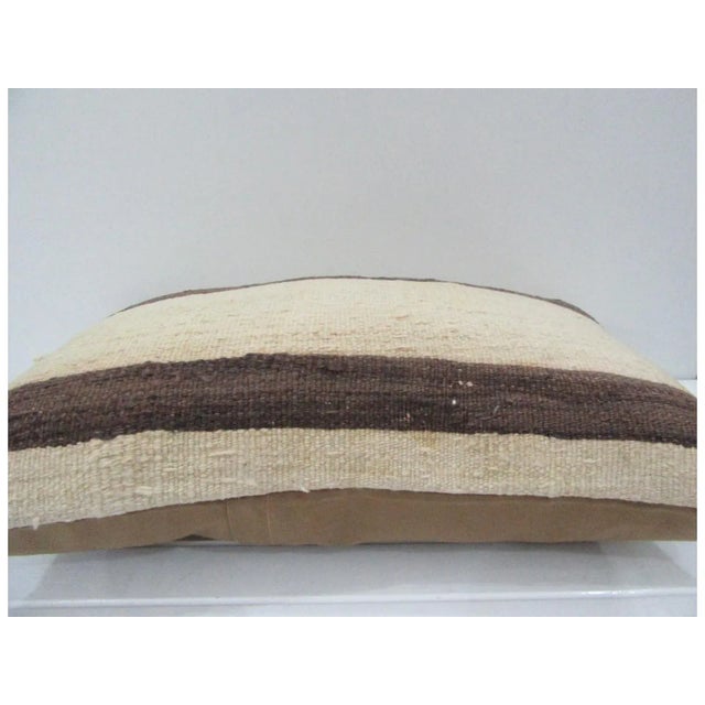 This is a pillow cover made from a vintage kilim rug. The piece was properly washed and ready to use. Pillow inserts not...