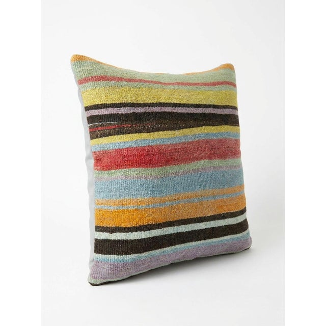 This beautiful 16'' x 16'' hand-woven Kilim pillow cover was made from an authentic Turkish kilim. The traditional flat-...