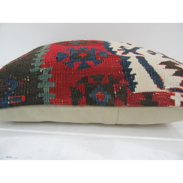This is a pillow cover made from a vintage kilim rug. The piece was properly washed and ready to use. Pillow inserts not...