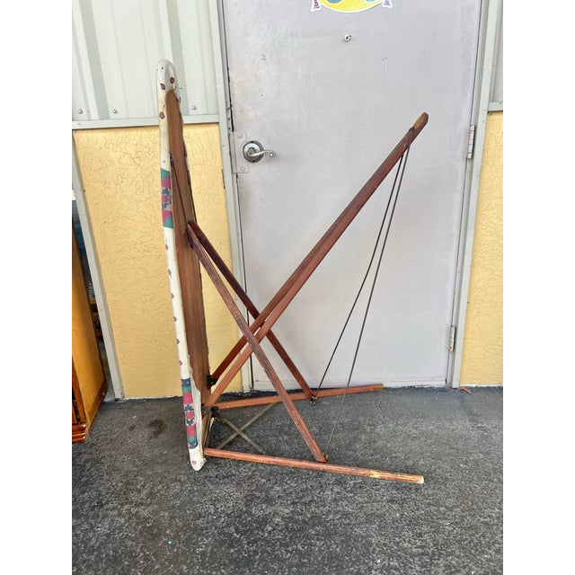 Early 20th Century Wooden Folding Ironing Board. This piece has great vintage character. It features vintage wooden legs...