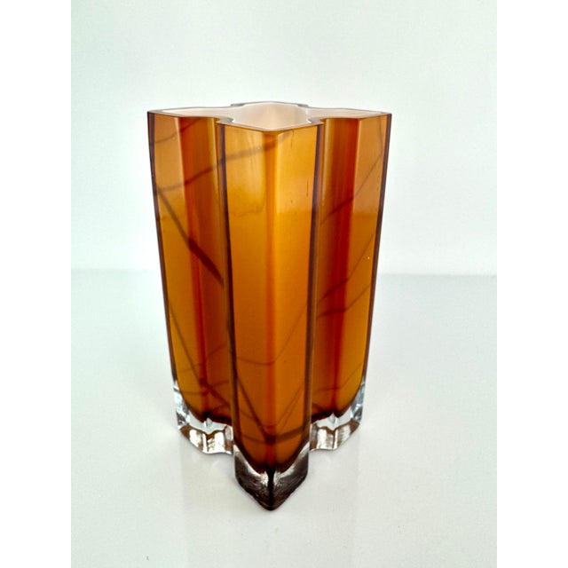 This striking Mid-Century Murano glass style vase embodies Italian craftsmanship with its sculptural cross-shaped...