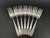 A nice set of seven silverplate individual salad forks in the Grosvenor pattern by Oneida Community. Designed by Grosvenor...