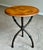 An elegant round accent table from the Milling Road collection by Baker Furniture, featuring a richly figured burl wood...