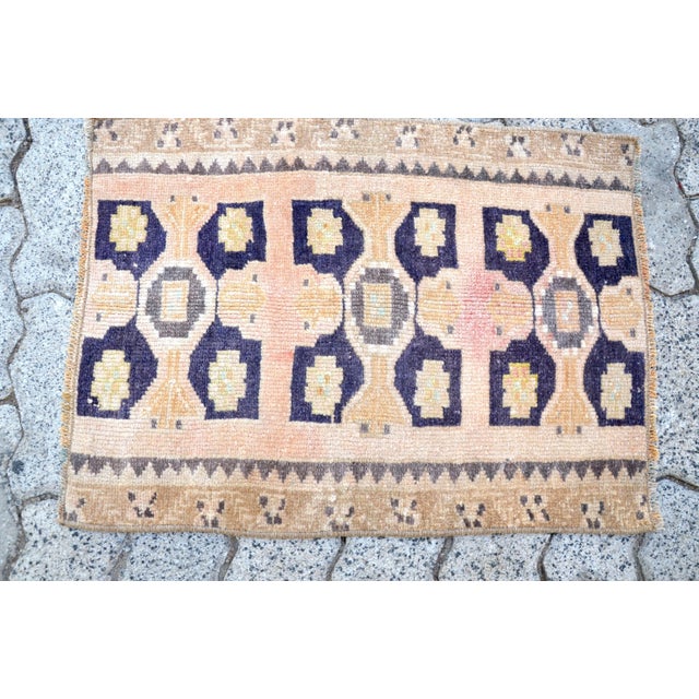 This is a vintage Turkish Oushak rug from the 1960s. The piece was hand-knotted.