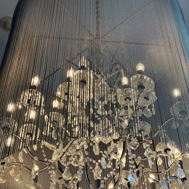 A shimmering veil of ball chain adds an industrial touch to the Victorian design of our opulent crystal glass and iron...