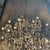 A shimmering veil of ball chain adds an industrial touch to the Victorian design of our opulent crystal glass and iron...