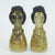Figural art pottery salt & pepper shakers shaped like two women with top knot hairstyles and medallion necklaces which...