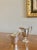 A set of two coordinating sterling silver creamers in a Neoclassical style. Wonderful forms that would be perfect for...