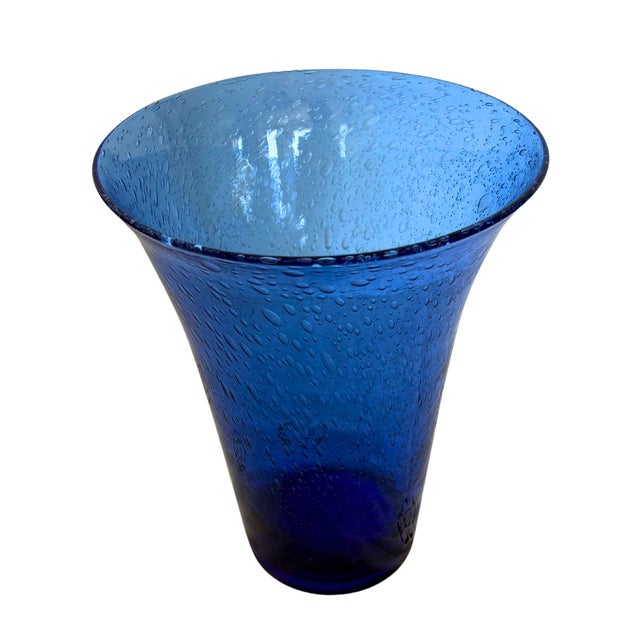 A striking piece of French Riviera glassmaking, this large Biot vase captivates with its rich cobalt blue hue and...