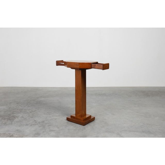 A refined and beautifully crafted example of French Art Deco design, this 1925 side table combines elegant geometry with...