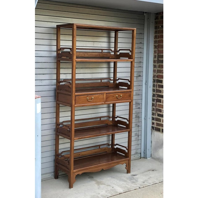 This exquisite bookcase is not just a piece of furniture; it's a testament to timeless craftsmanship. Impeccably...
