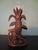 Masterpiece vase holder ,walnut wood ,with frontal sculpture of a Fox and behind a Annanas fruit, with leaves and floreal...