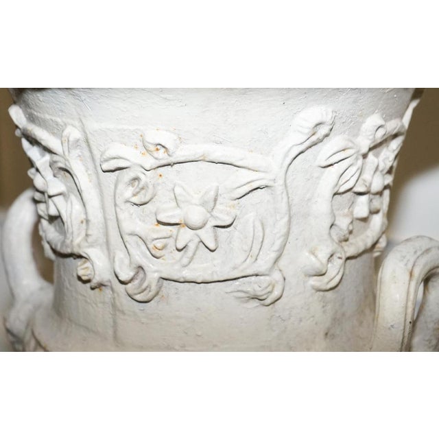 This stunning antique cast iron garden urn is a timeless statement piece, ideal for enhancing traditional gardens,...