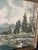 Gorgeous mountain lake with snow capped mountains and evergreens in the background. This is a unique piece. Oil painted on...
