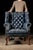 Vintage leather armchair on clawfoot legs. This vintage armchair features a deep blue finish over tufted leather and a...