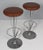 Piet Hein pair of bar stools original upholstered with patinated leather leather. Made by Fritz Hansen. This piece is...
