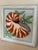 Charming vintage needlepoint featuring a beautifully stitched nautilus shell in warm shades of rust, cream, taupe, and...