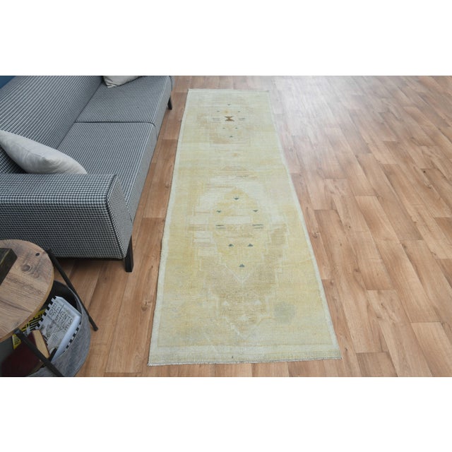 This vintage hand-knotted area rug is a semi-antique vintage area rug. The '70s Eastern region of Anatolian's unique rug...