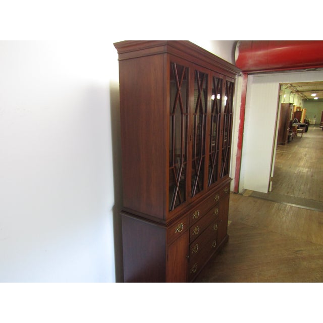 Item 87183: Henkel Harris solid cherry china cabinet. Age: 1979. Details: Two piece construction, lighted interior,...