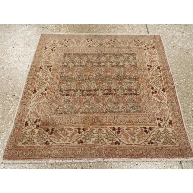This early 20th-century Persian Tabriz Hagi Jalili rug, measuring 2' 0" × 2' 1", exemplifies the refinement and artistic...