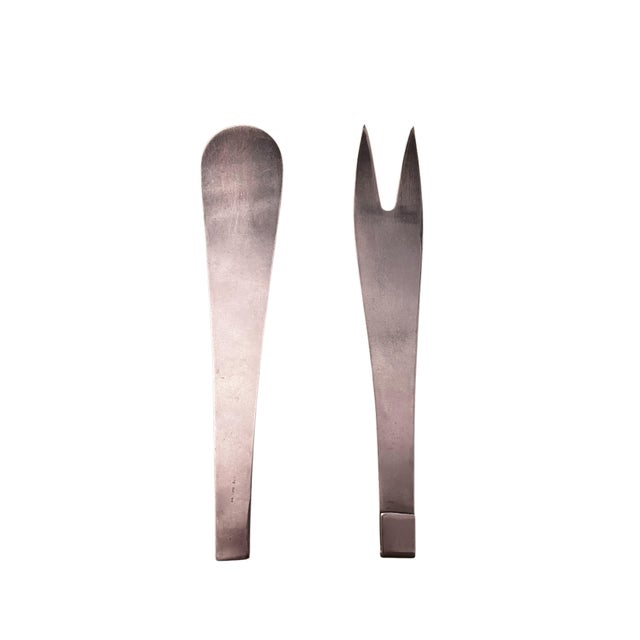 Perfectly shaped two-piece salad servers, designed by Prof. Carl Auböck, for Amboss Werke Neuzeughammer, Austria. The...
