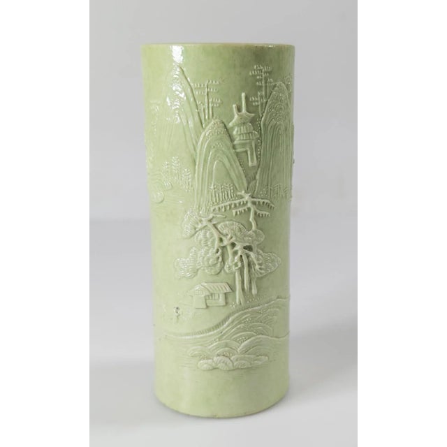 We are selling this lovely molded Chinese pen holder or brushpot. This brushpot has decoration of a landscape on molded...