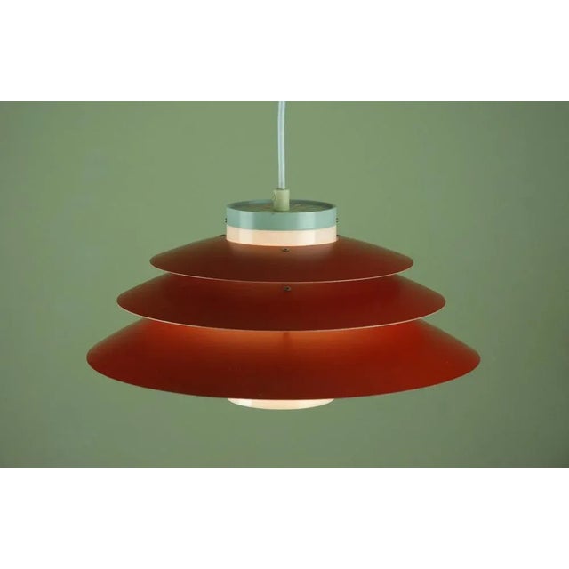 Designed by Danish architect-designer Bent Karlby and produced by Lyfa in the 1960s. Trenta is a multi-layered pendant...