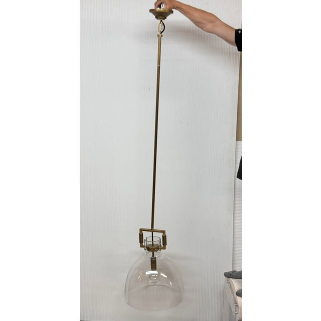 Design Plus Gallery presents a Brass with Single Glass Pendant Light from Living Design. The exquisite pendant is in a...