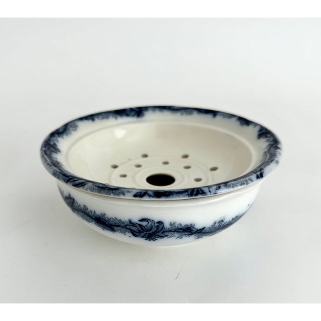 A late 19th to early 20th Ceramic strainer insert and bowl from the historic Faiencerie de Nimy in Belgium featuring a...