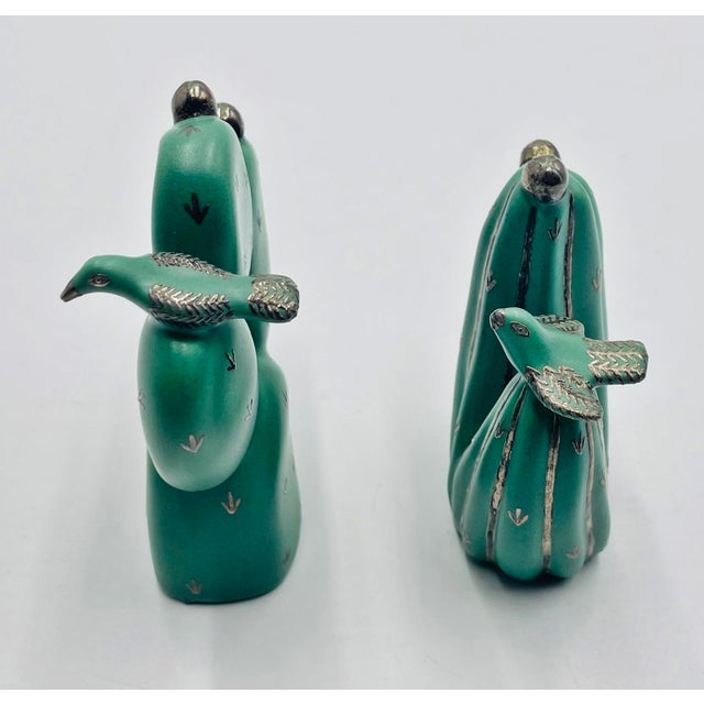 This sculptural set of salt and pepper shakers was designed and manufactured in Taxco, Mexico by Emilia Castillo, a...