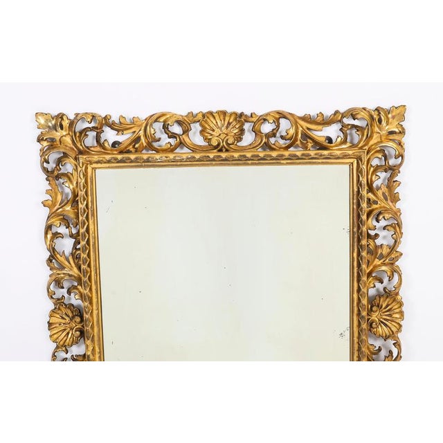 A superbly carved and highly decorative fine-quality Italian Florentine giltwood mirror, mid-19th century in date. This...